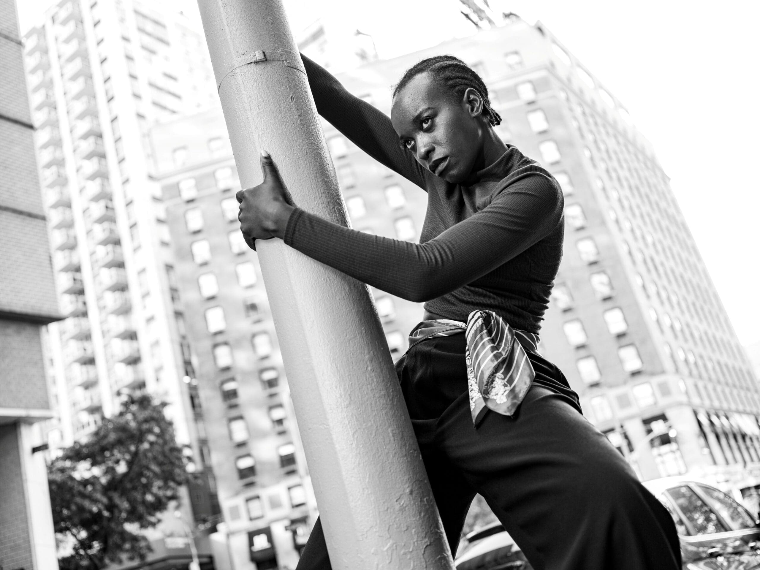 Esther Musonda holding a pole